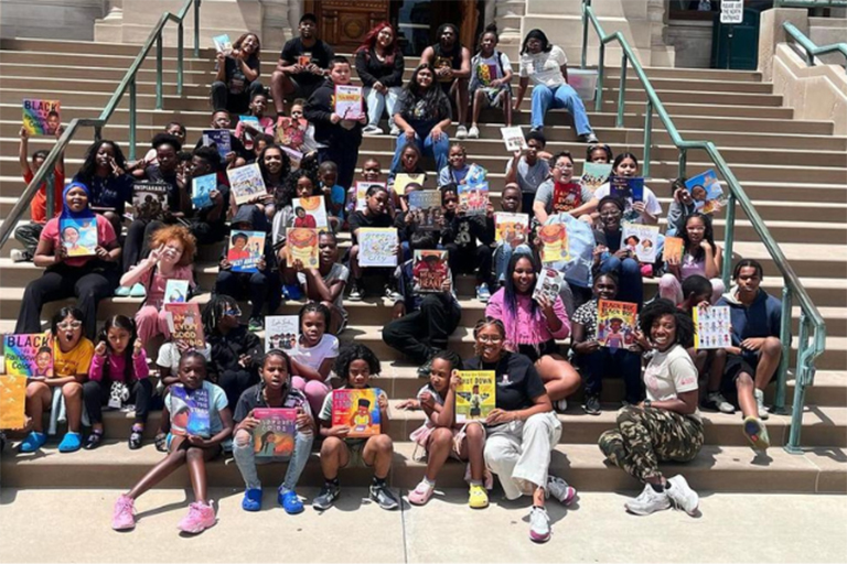 Freedom School students outside of the Indiana Statehouse with their posters